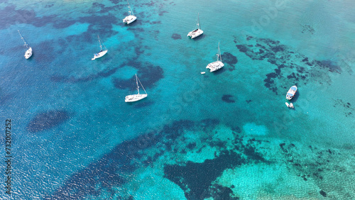 Aerial drone photo of sail boats anchored in paradise island of Paxos, Ionian sea, Greece