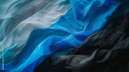 Estonia Flag for olympic games, elegant wavy flowing silk fabric texture depicting luxury and fluidity.