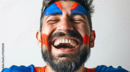 Armenian flag face paint, Close-up of a person's face, symbolizing patriotism or sports fandom.