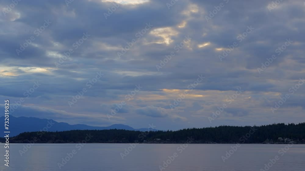 Establishing shot of ocean beach with rocks and pebbles in slow motion at summer day in Vancouver, Canada, North America. Day time on September 2023. Still camera. ProRes 422 HQ. Establishing shot of ocean beach with rocks and pebbles in slow motion at summer day in Vancouver, Canada, North America. Day time on September 2023. Still camera. ProRes 422 HQ.