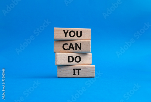 You can do it symbol. Concept words You can do it on wooden blocks. Beautiful blue background. Business and You can do it concept. Copy space.