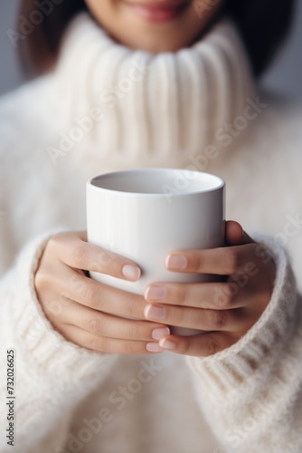 Close-up in female hands of coffee mug