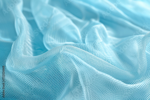 Closeup of abstract fishnet on light blue background.