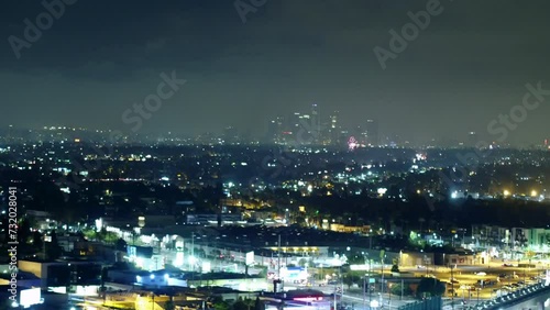 Wallpaper Mural Aerial Panning Shot Of Fireworks Bursting In Illuminated Modern City At Night - Los Angeles, California Torontodigital.ca