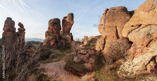 A scenic landscape of the Belogradchik Rocks in Bulgaria with impressive rock formations with amazing light at golden hour in winter. Belogradchik, Bulgaria