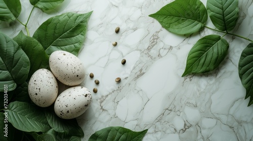 a bunch of green leaves surrounding Easter eggs over a marble counter,