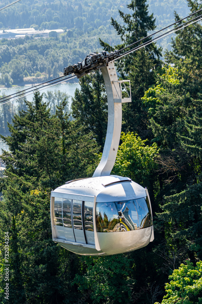 A photo of the Portland Aerial Tram transporting riders to a hilltop in Portland Oregon.