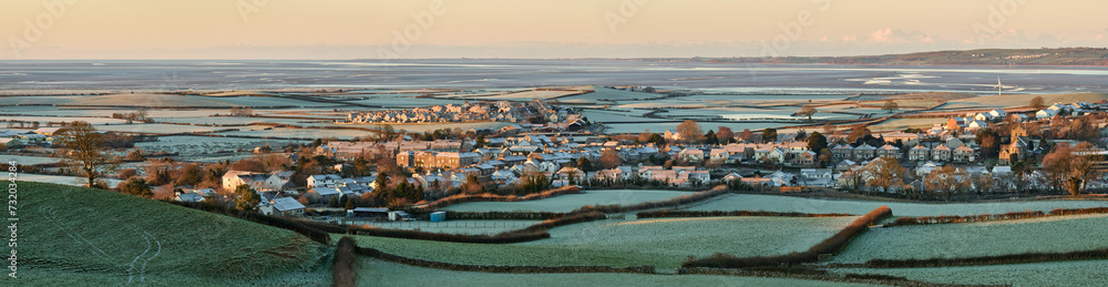 Panorama of Flookburgh, Cark and Ravenstown, with Morecambe Bay in the distance, on a frosty winters morning. - obrazy, fototapety, plakaty 