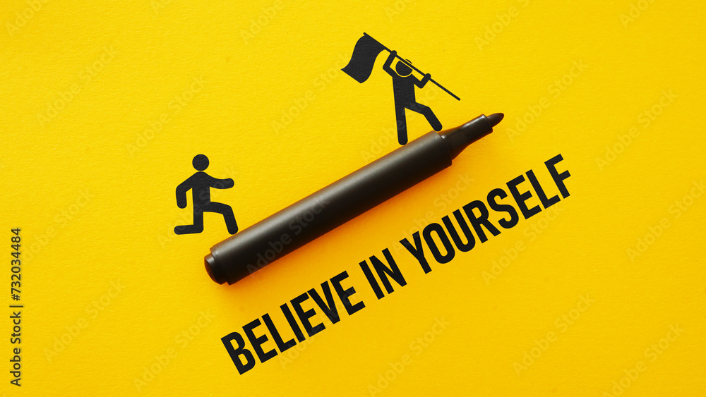 Believe in yourself is shown using the text and picture of running man - obrazy, fototapety, plakaty 