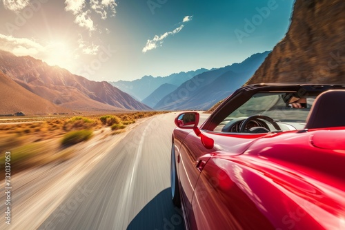 A sports car speeding along a mountainous road