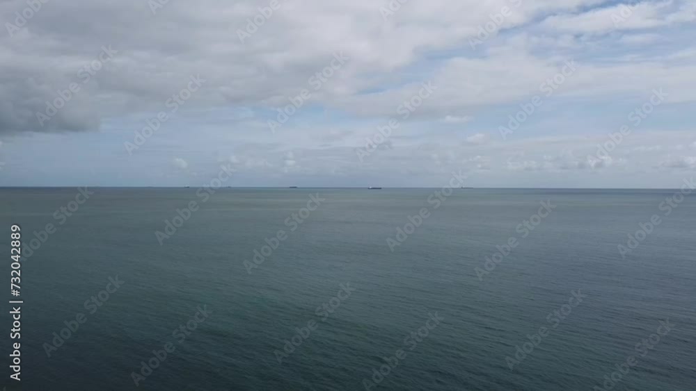 transportation ships sail across the sea next to isle of whight transportation ships sail across the sea next to isle of whight