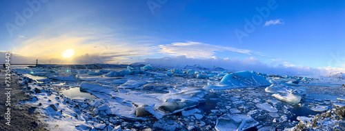 Icebergs swimming at the famous glacier lagoon around Vatnajokull National Park during winter around sunset time 