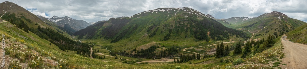 Fototapeta premium Mountain tundra valley panorama in the summer with stormy skies