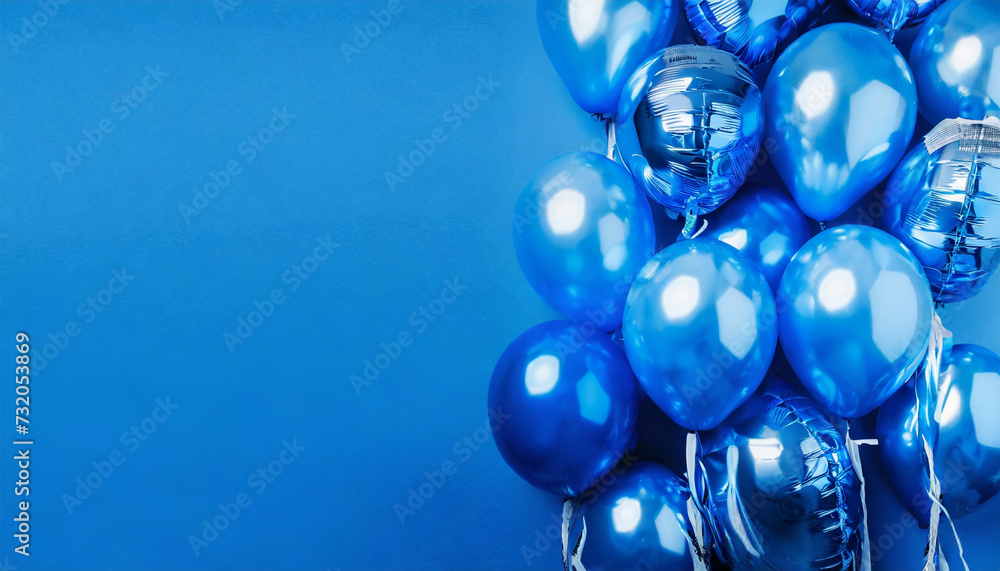 Blue foil balloons with helium with copy space. Holiday celebration concept, baby shower or birthday Blue foil balloons with helium with copy space. Holiday celebration concept, baby shower or birthday