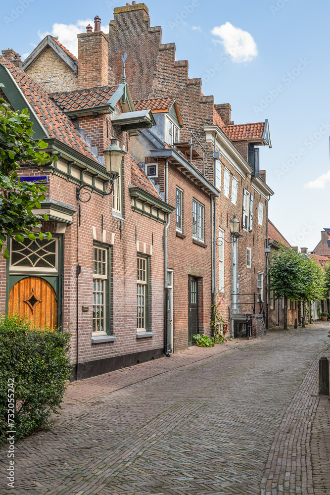Narrow old street with wall houses in the old part of Amersfoort. Narrow old street with wall houses in the old part of Amersfoort.