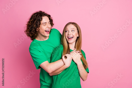 Canvas Print Portrait of couple laughing friends have fun together buddies at party wear same