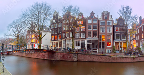 Typical houses and bridge at winter Amsterdam canal Brouwersgracht, Holland, Netherlands