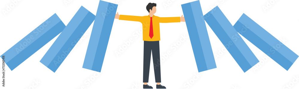 Businessman blocking domino effect
Businessman blocking domino effect