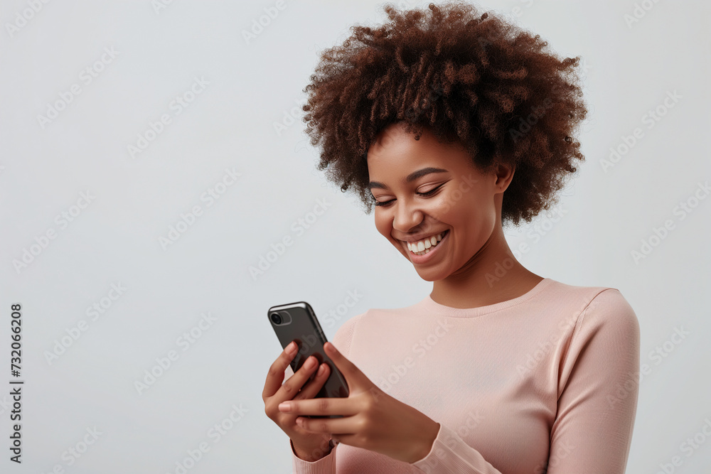African Girl in Casual Longsleeve Smiling, Using Smartphone African Girl in Casual Longsleeve Smiling, Using Smartphone