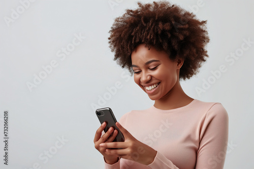 African Girl in Casual Longsleeve Smiling, Using Smartphone