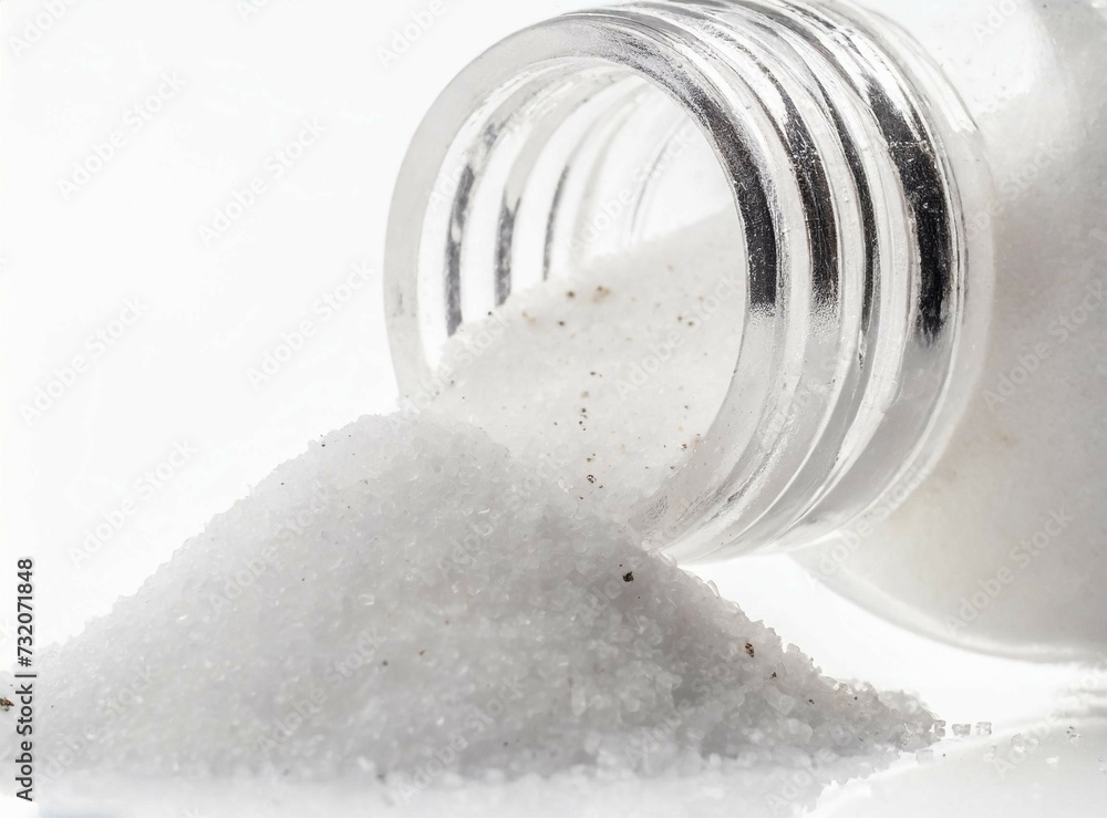 Salt from a bottle isolated on white background Salt from a bottle isolated on white background