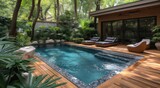 A tranquil oasis awaits at this luxurious resort, where lush trees and plants surround a sparkling swimming pool, inviting guests to relax on lounge chairs and soak up the sun on the spacious deck