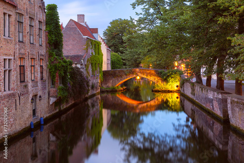 Scenic evening cityscape with medieval Green canal, Groenerei, in Bruges, Belgium photo
