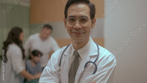 Successful doctor looks at Camera and Smiles