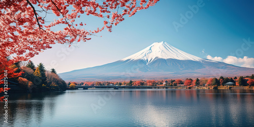 Mt. Fuji, mount Fuji-san tallest volcano mountain in Tokyo, Japan. Snow capped peak, conical sacred symbol, autumn fall, red trees, nature landscape backdrop background wallpaper, travel destination