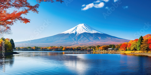 Mt. Fuji, mount Fuji-san tallest volcano mountain in Tokyo, Japan. Snow capped peak, conical sacred symbol, autumn fall, red trees, nature landscape backdrop background wallpaper, travel destination