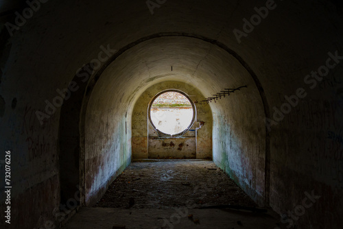 Siedliska, Subcarpathian, Poland - 25 November 2023: Fort GHW I „Salis-Soglio” - interior of the residential casemate with a round window for 10 soldiers  photo