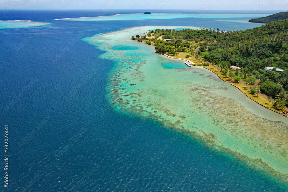 Aerial view of the coral reef, South Pacific Ocean, and the island of Raiatea near the Marae Taputapuatea in Opoa on the south eastern coast of Raiatea Aerial view of the coral reef, South Pacific Ocean, and the island of Raiatea near the Marae Taputapuatea in Opoa on the south eastern coast of Raiatea