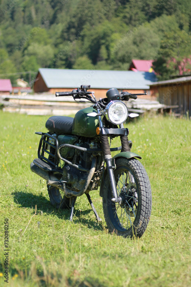 Naklejka premium Classic motorcycle in the village
