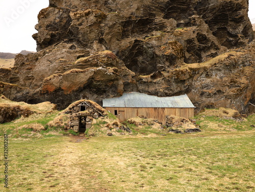 Drangurinn í Drangshlíð is a characteristic tuff rock formation that stands alone on the grazing land of Drangshlíð farm photo