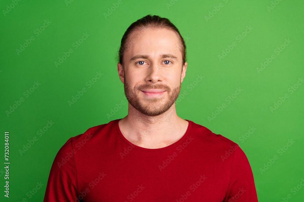 Portrait of serious confident handsome guy with bristle long hairstyle wear red sweatshirt look at you isolated on green color background Portrait of serious confident handsome guy with bristle long hairstyle wear red sweatshirt look at you isolated on green color background