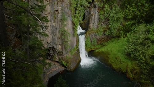 Huge waterfall in lush forest, Oregon.