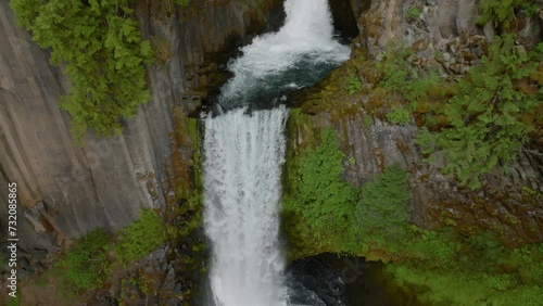 Huge waterfall in lush forest, Oregon.