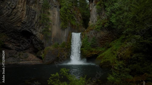 Huge waterfall in lush forest, Oregon.