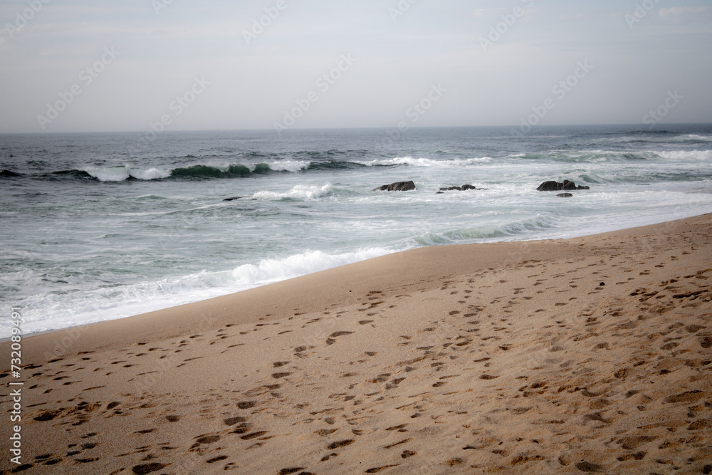 waves on the beach over the sand