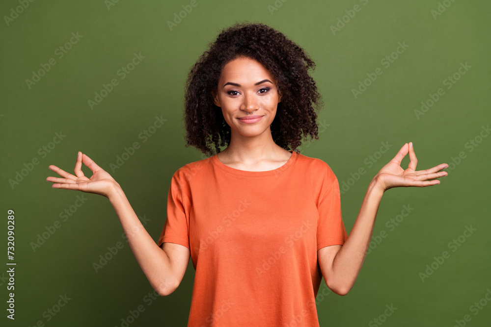 Photo portrait of lovely young lady meditate gesture pose calm smile dressed stylish orange garment isolated on khaki color background Photo portrait of lovely young lady meditate gesture pose calm smile dressed stylish orange garment isolated on khaki color background