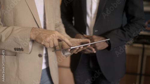 Businessman checking warehouse with staff