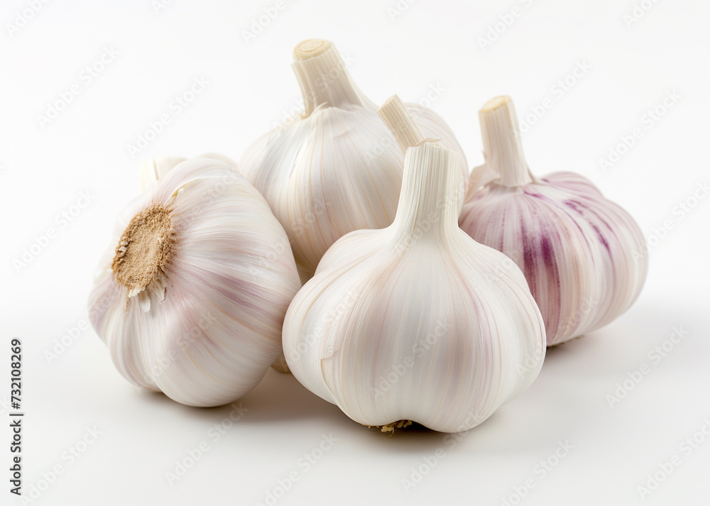 A close-up image of five fresh garlic bulbs with varying shades of white and purple, neatly arranged against a pristine white background. A close-up image of five fresh garlic bulbs with varying shades of white and purple, neatly arranged against a pristine white background.