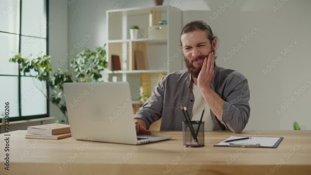 Man Freelancer Suddenly Feeling Tooth Pain During Work. Man in Shirt Suffering From Tooth Pain Grimacing in Pain. Medical Concept. Man Freelancer Suddenly Feeling Tooth Pain During Work. Man in Shirt Suffering From Tooth Pain Grimacing in Pain. Medical Concept.