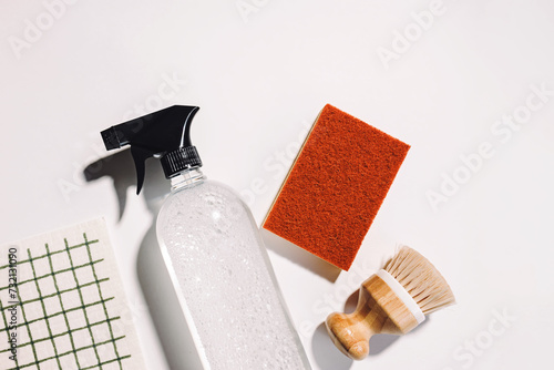 Eco cleaning tools and supplies, bottle with vinegar, wooden brush and reusable dishcloth