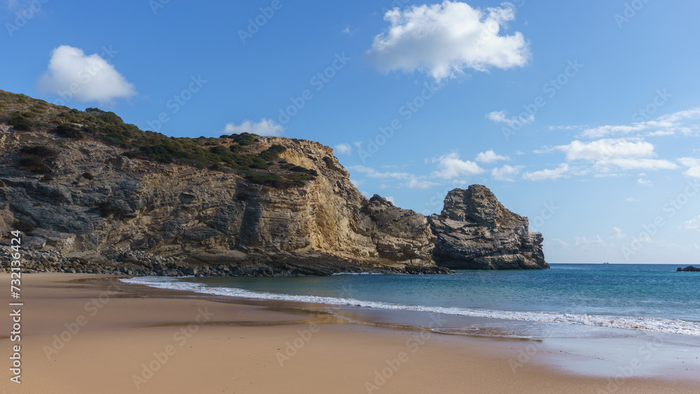 View st the beach of Praia do Barranco with clear turquoise water and a blue sky, Sagres, Algarve, Portugal