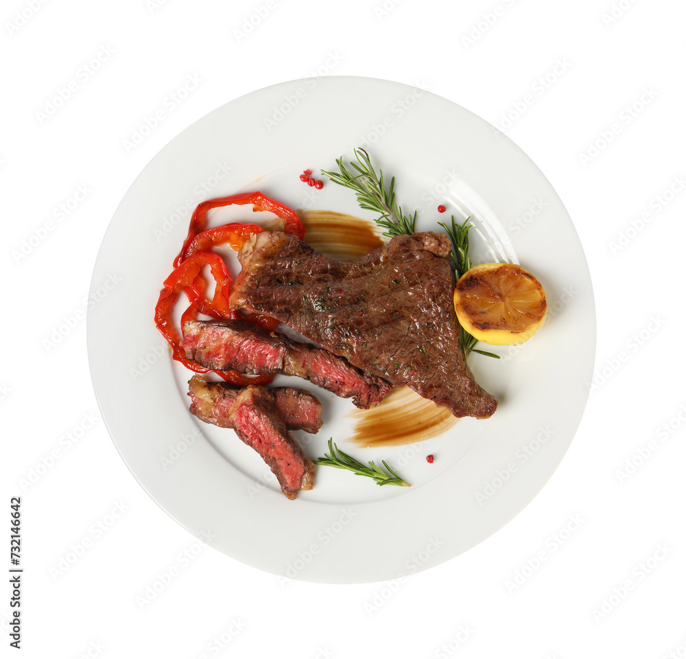 Delicious grilled beef steak with pepper, spices and lemon isolated on white, top view