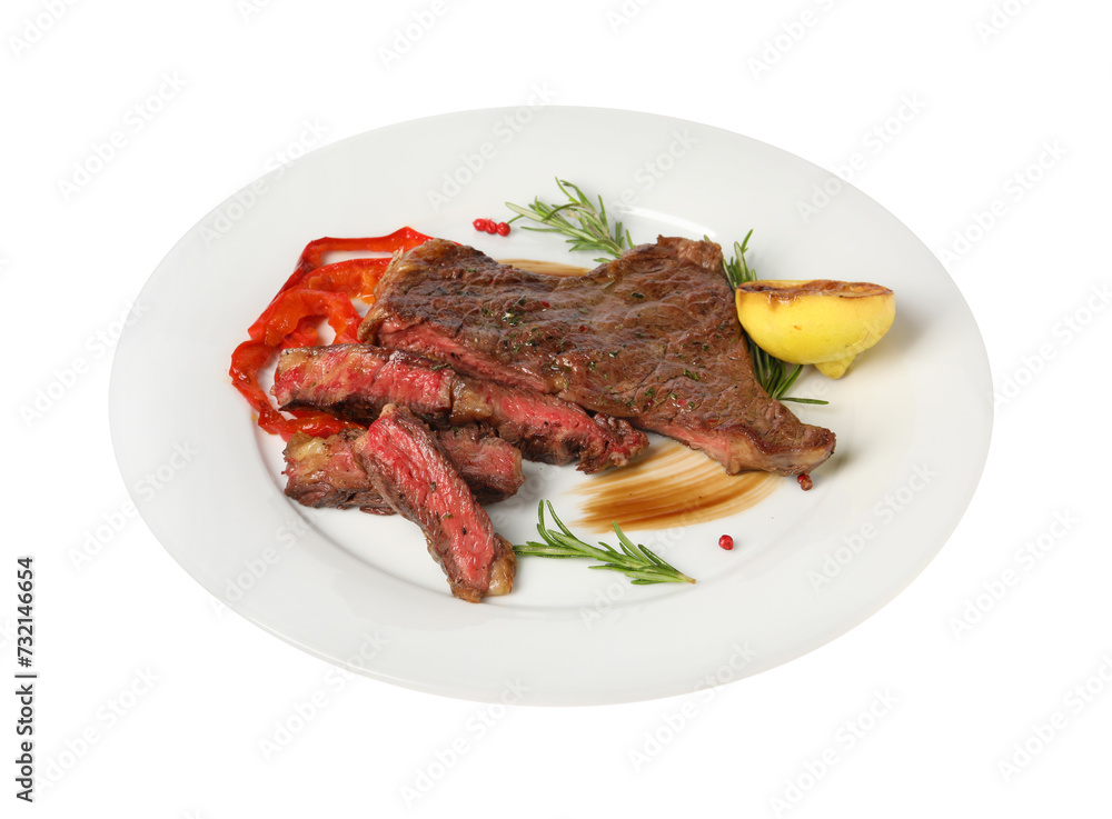 Delicious grilled beef steak with pepper, spices and lemon isolated on white Delicious grilled beef steak with pepper, spices and lemon isolated on white