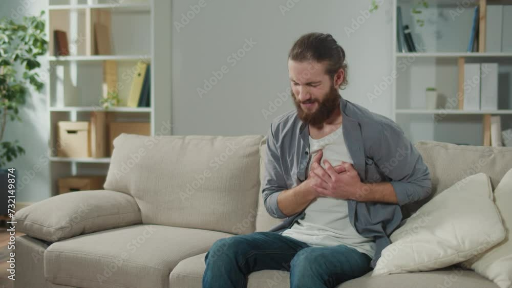 Man has Got the Symptoms of Heart Attack. Breathing Problems, Chest Pain. has Difficulty Breathing, Hand Touches Chest. Heart Attack, Thoracic Osteochondrosis, Panic Attack Man has Got the Symptoms of Heart Attack. Breathing Problems, Chest Pain. has Difficulty Breathing, Hand Touches Chest. Heart Attack, Thoracic Osteochondrosis, Panic Attack
