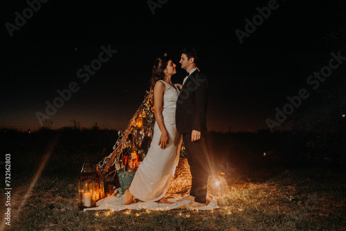 Happy wedding photography of bride and groom at wedding ceremony. Outdoor session