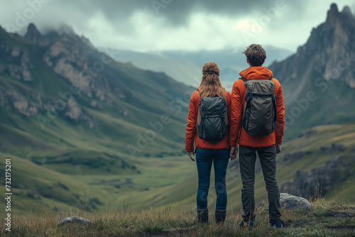 Highland Companionship: Explorers Gazing Over Misty Mountains"